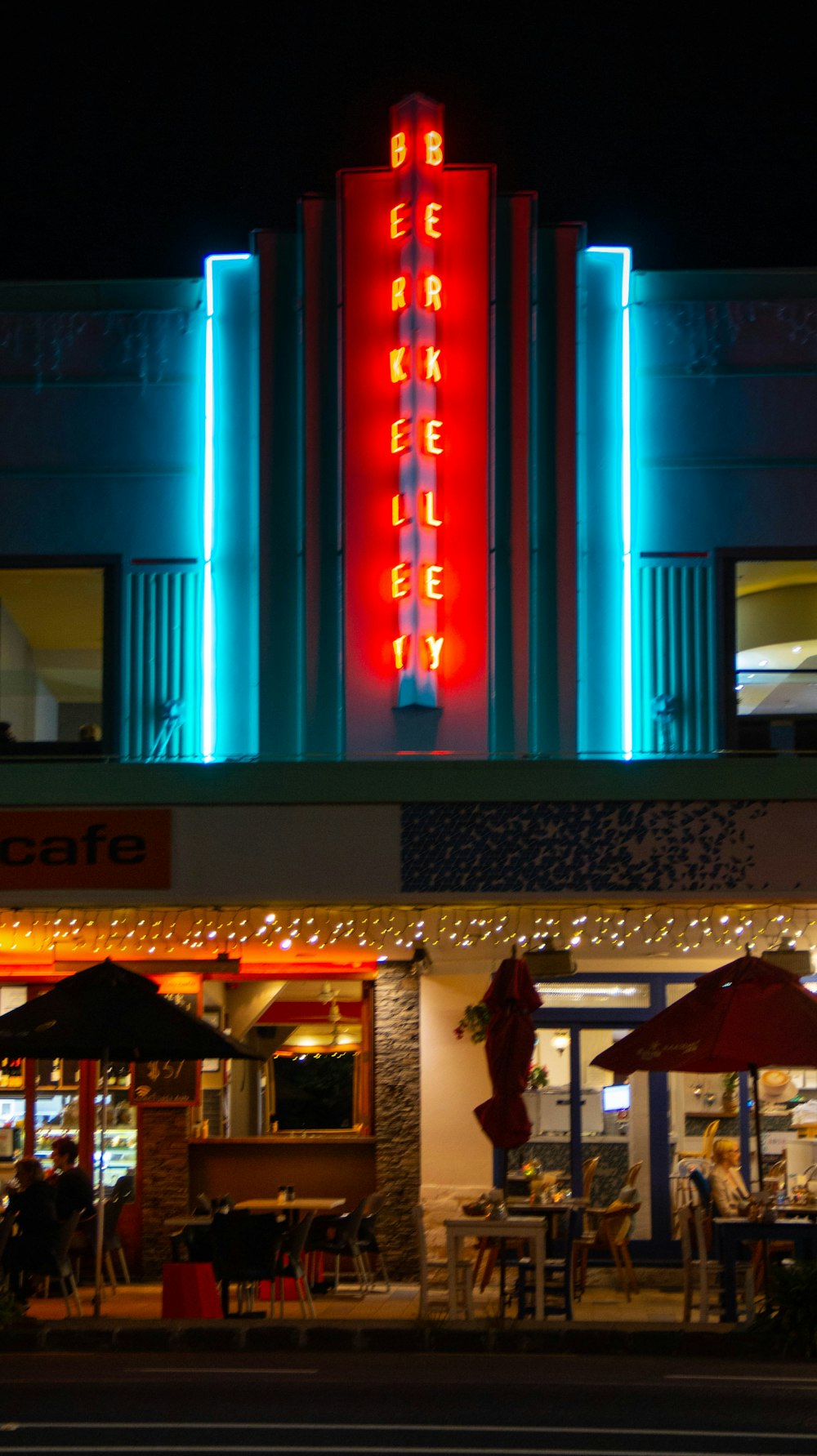 a building with a neon sign on the front of it