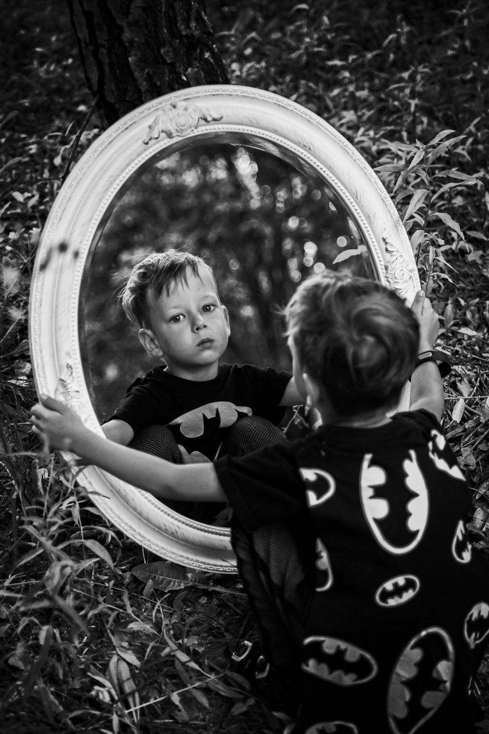 grayscale photo of 2 children in black and white shirt
