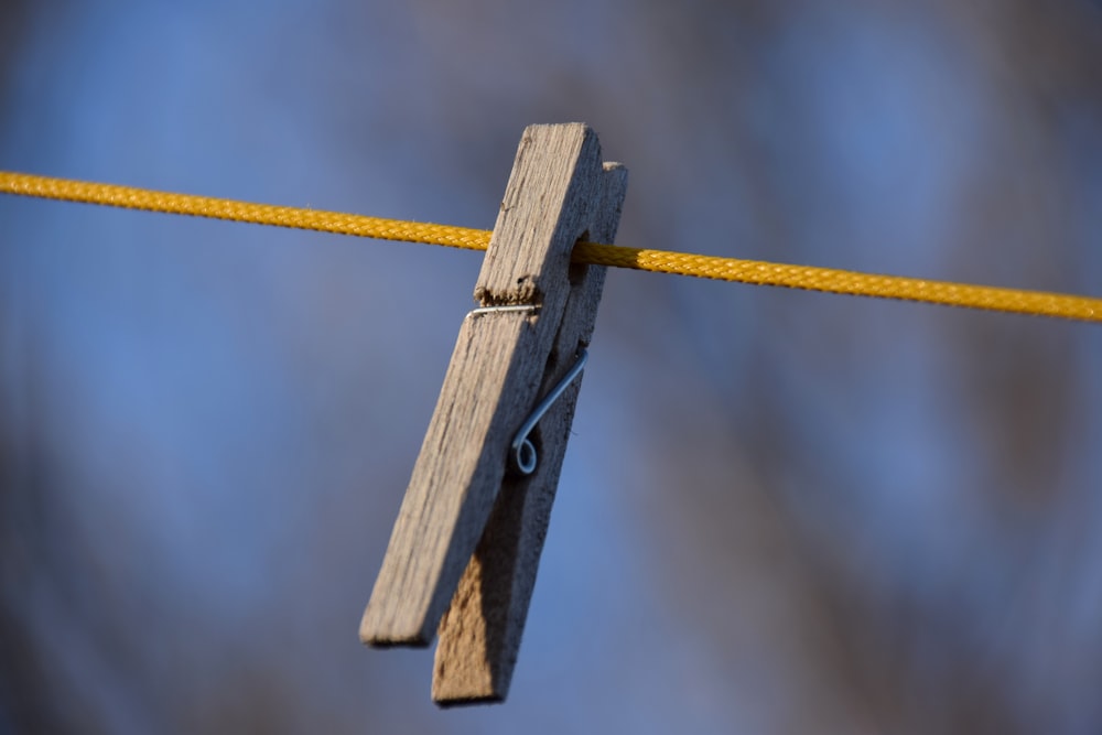 brown wooden clothes pin in tilt shift lens