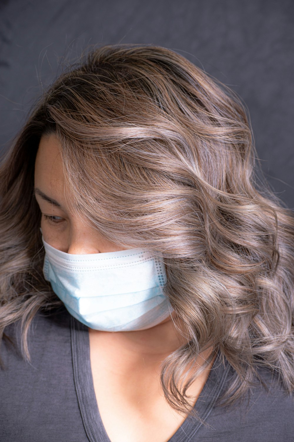 woman in white face mask