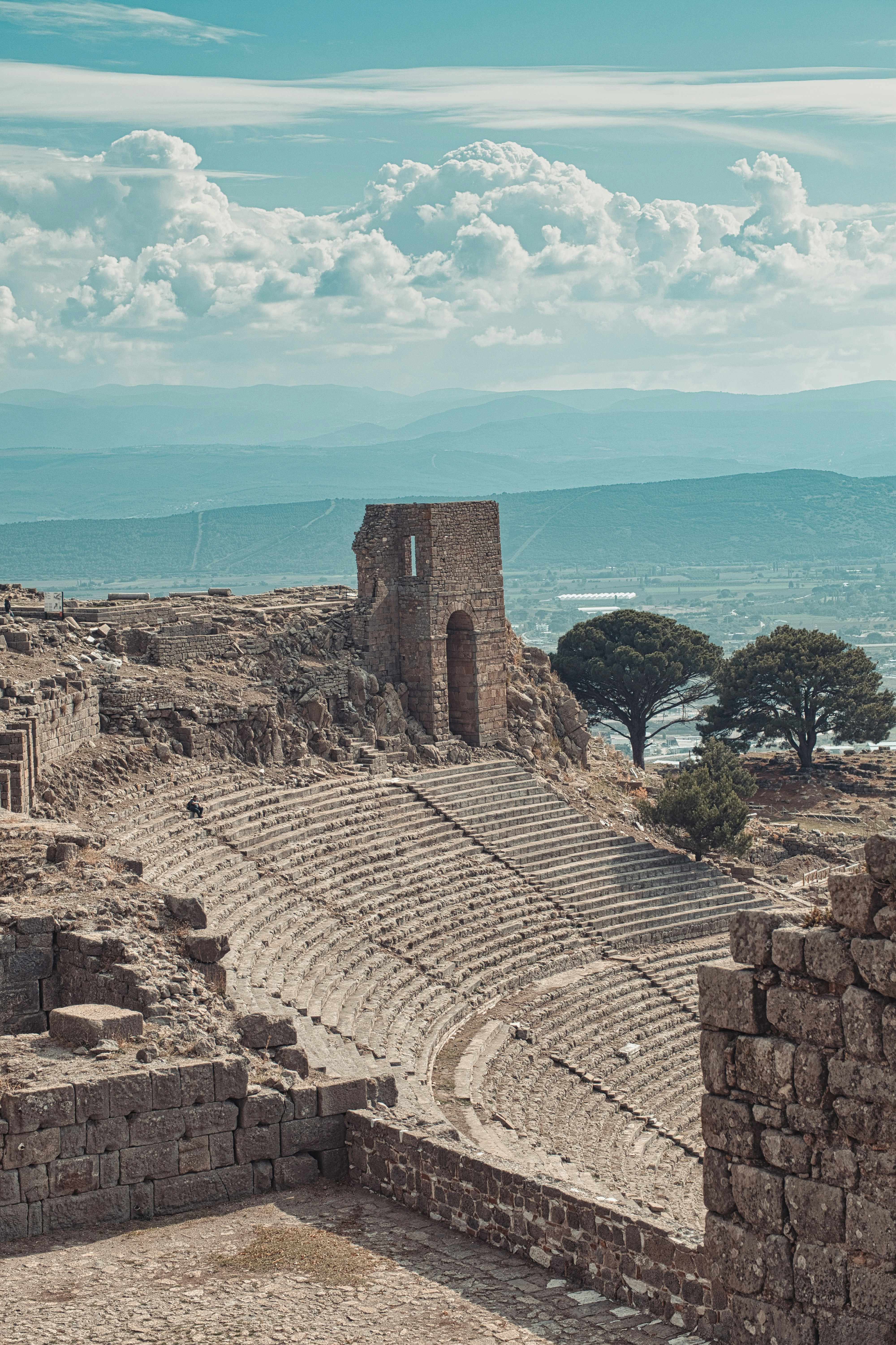 brown brick building near green trees during daytime