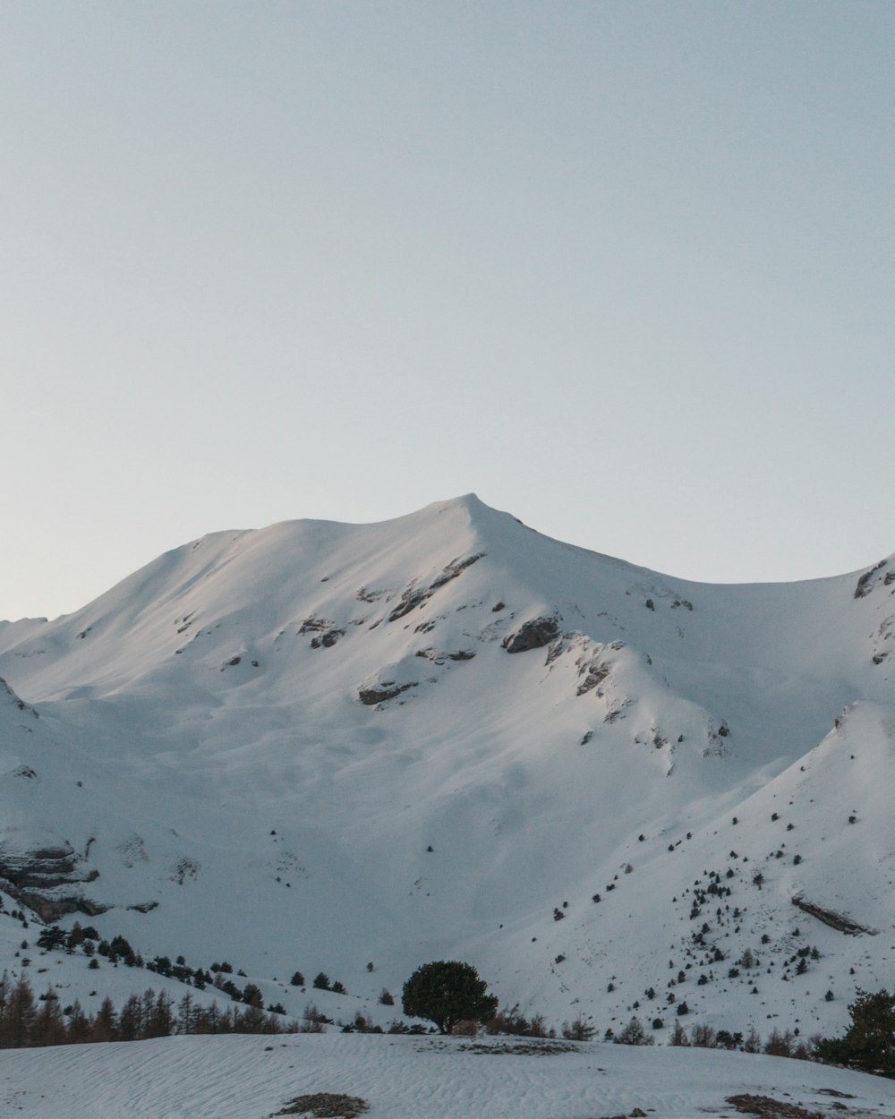 snow covered mountain during daytime