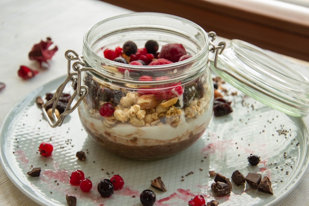 clear glass jar with red and white fruits inside