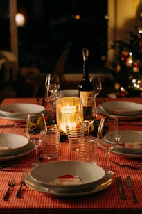 wine glasses on red ceramic plate