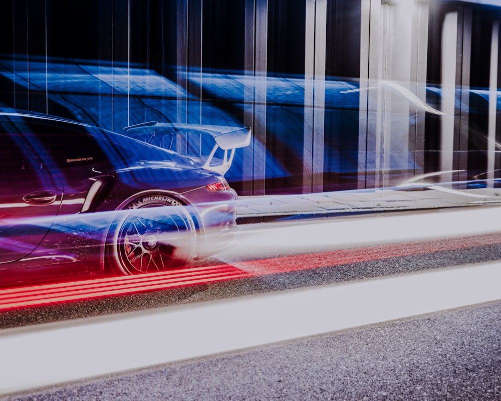 red car on road during daytime