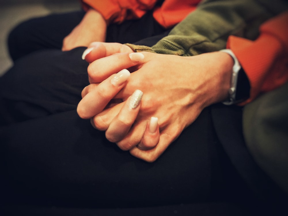 person in black pants with silver ring