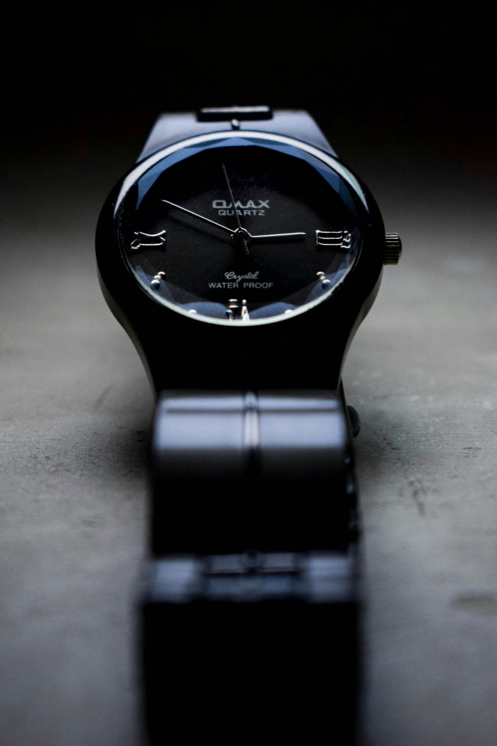 black and silver round analog watch