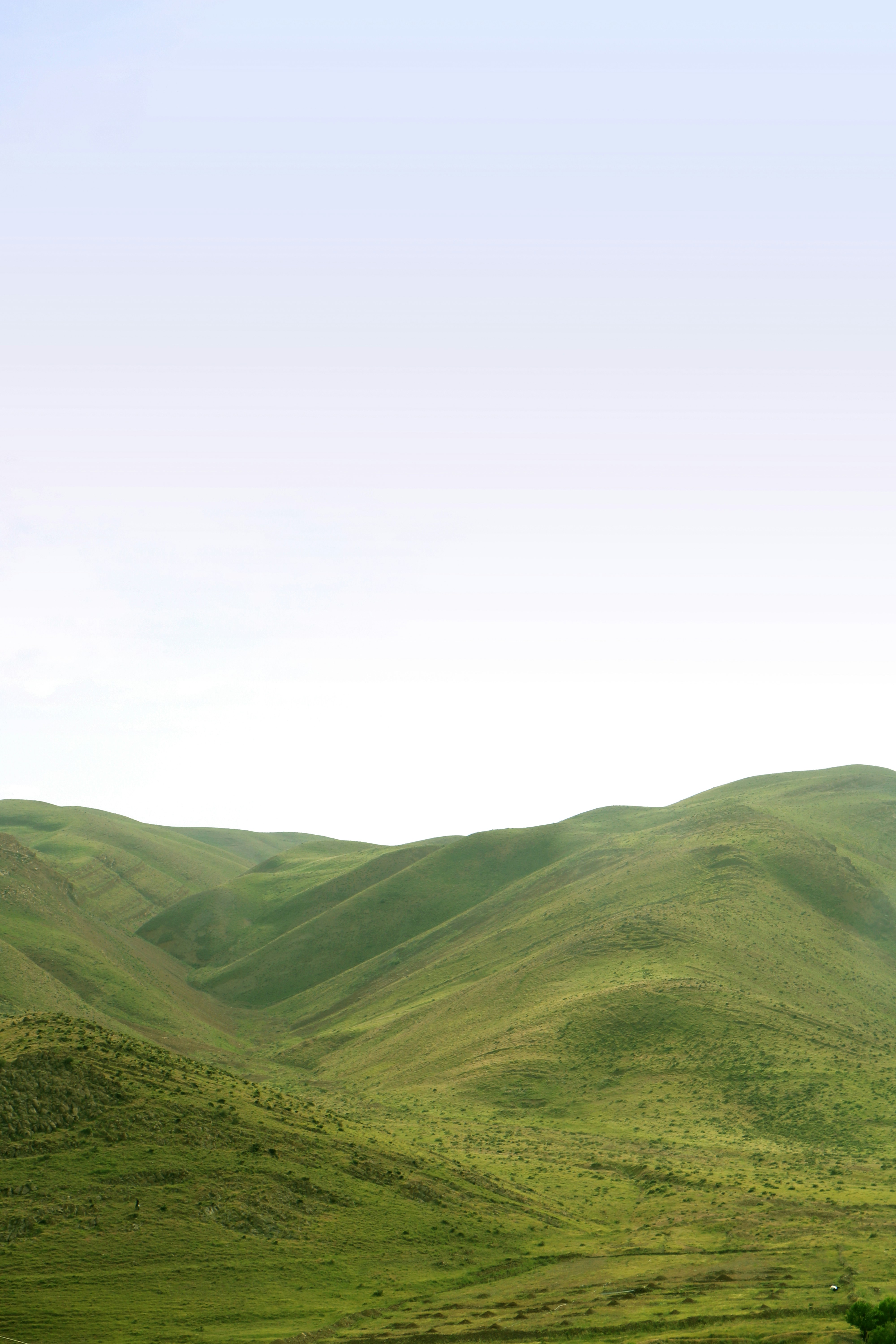 green mountains under white sky during daytime