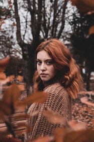 A woman with warm copper hair in a layered bob, perfect for autumn.