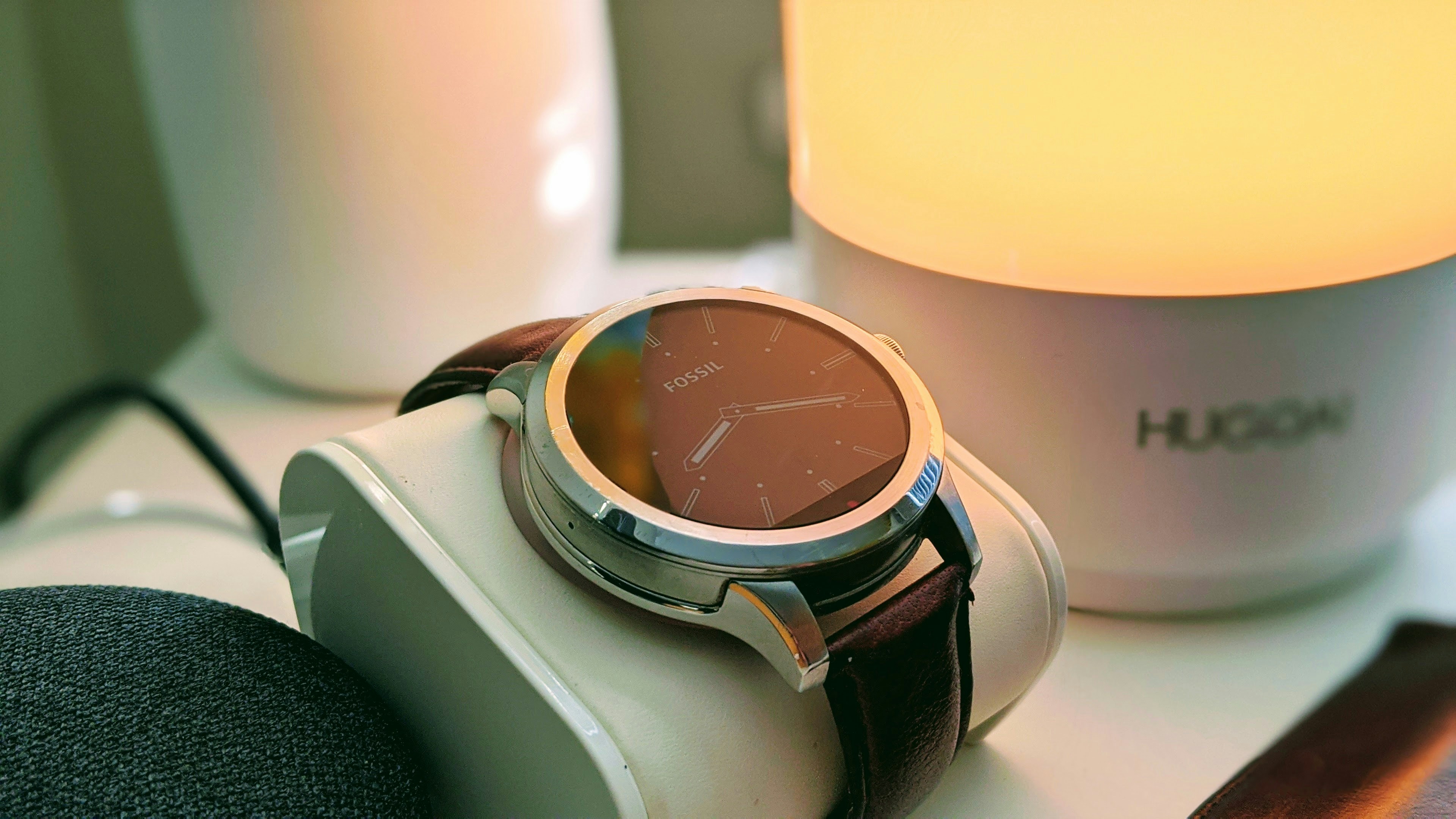 silver and black round analog watch