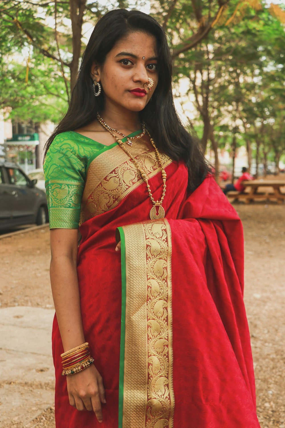 woman in red and green sari