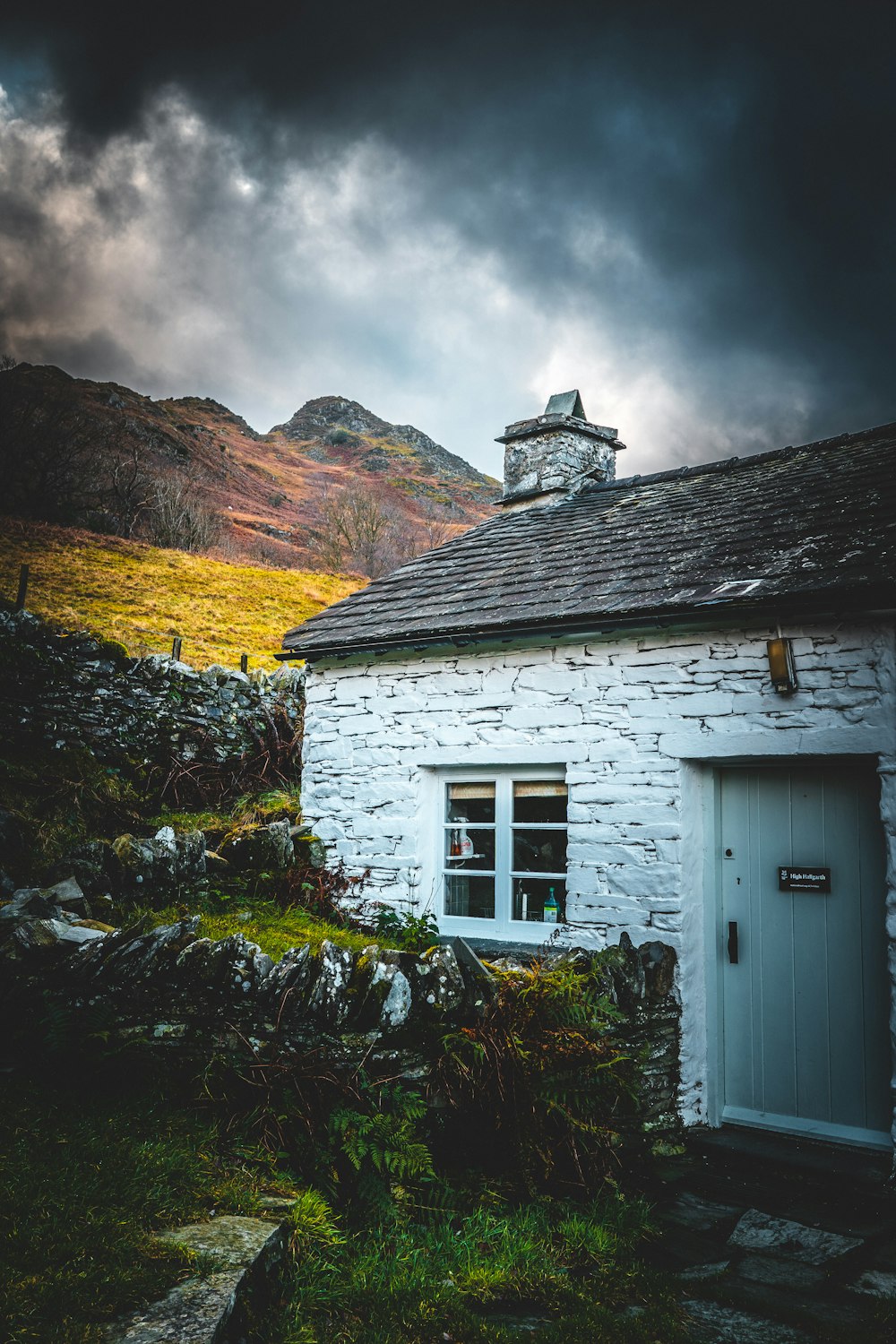 white wooden house on hill