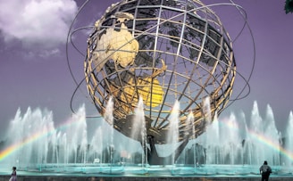 white and brown round ball on water fountain