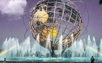 white and brown round ball on water fountain