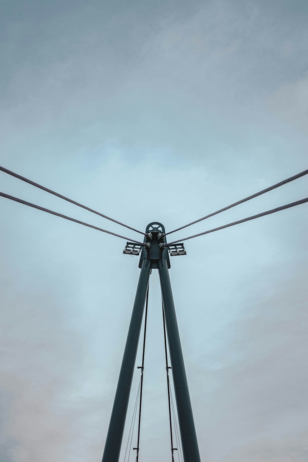 black metal tower under white clouds