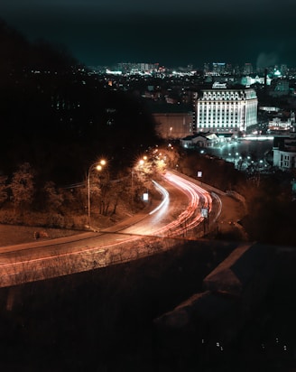 time lapse photography of cars on road during night time
