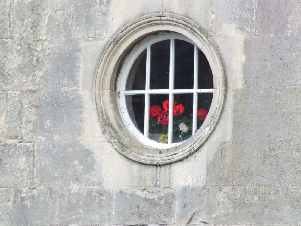 red metal window frame on gray concrete wall