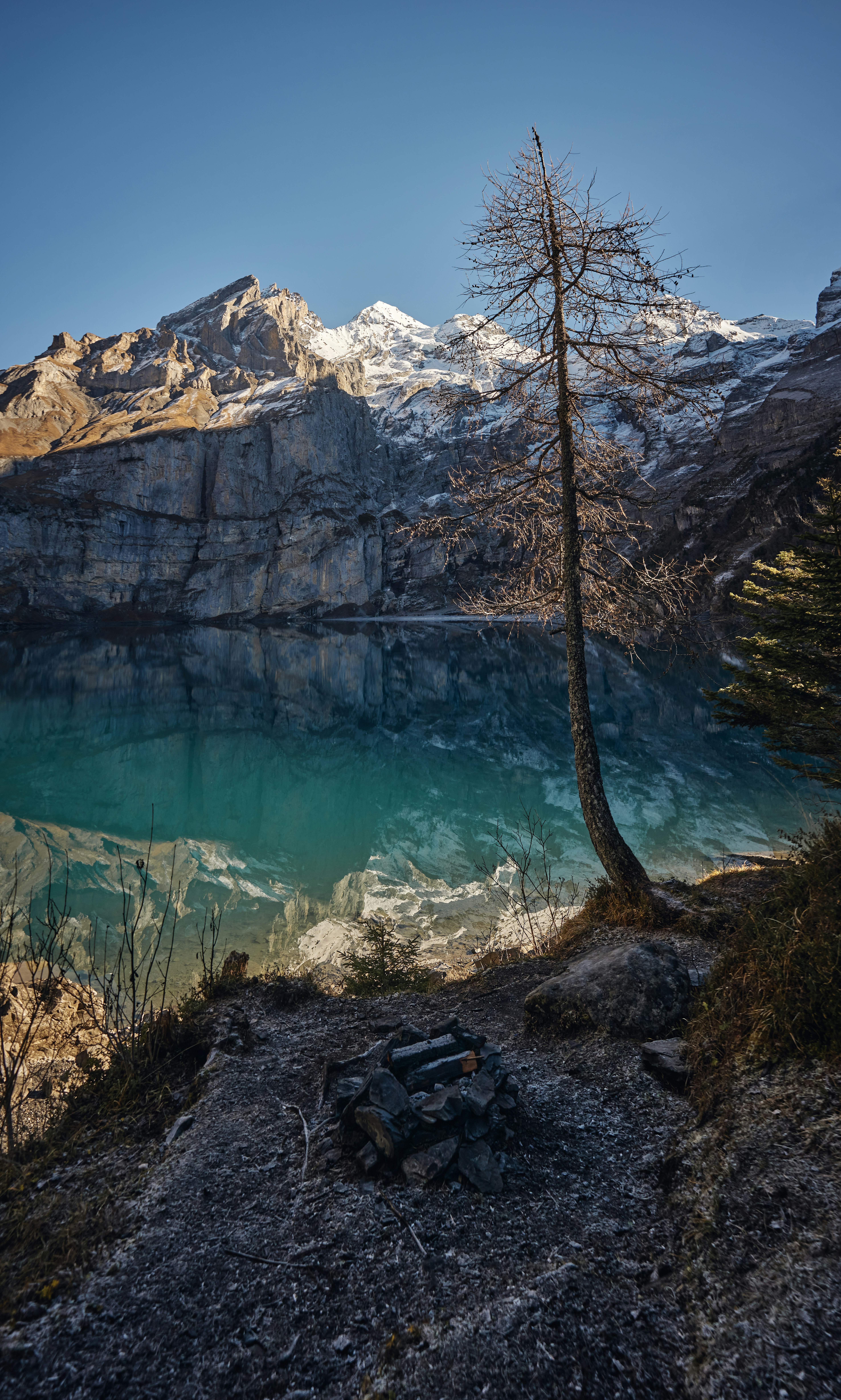 brown and white mountains near body of water during daytime