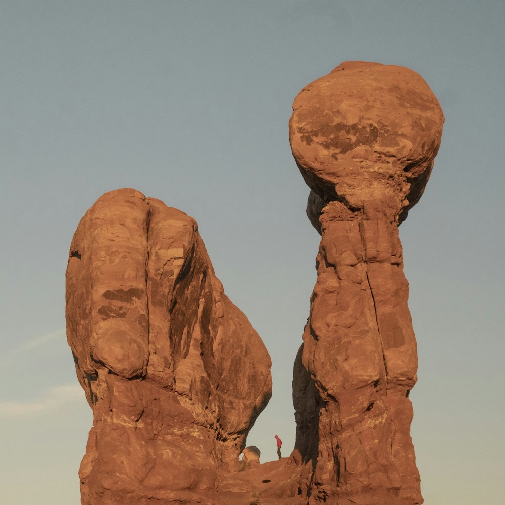 brown rock formation under blue sky during daytime