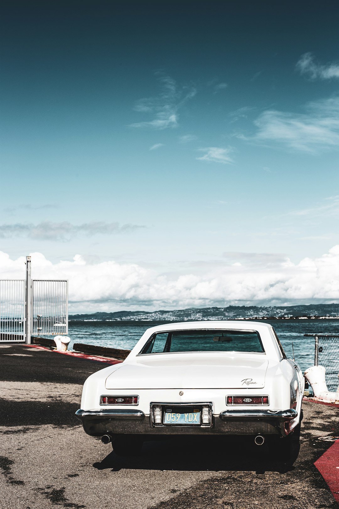 white chevrolet car on road during daytime