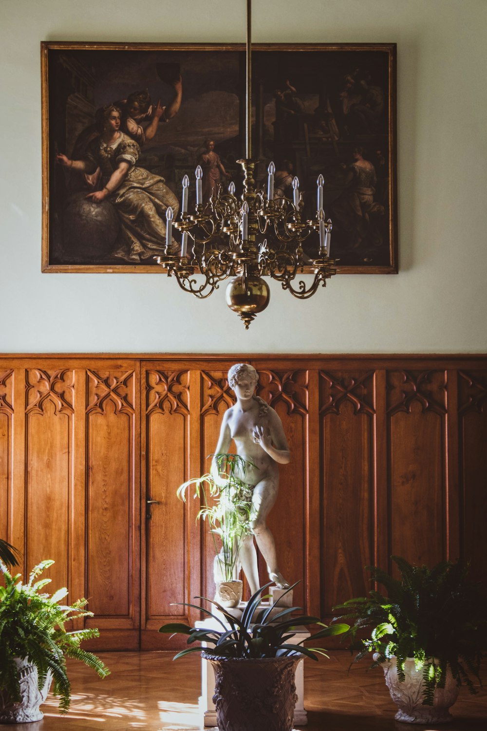 silver and gold framed uplight chandelier