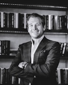 A candid shot of the author smiling during a book signing event.