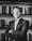 man in black suit jacket smiling