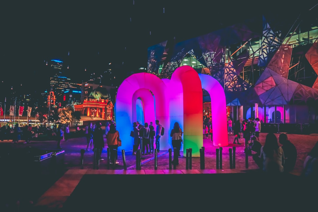 people walking on street during nighttime