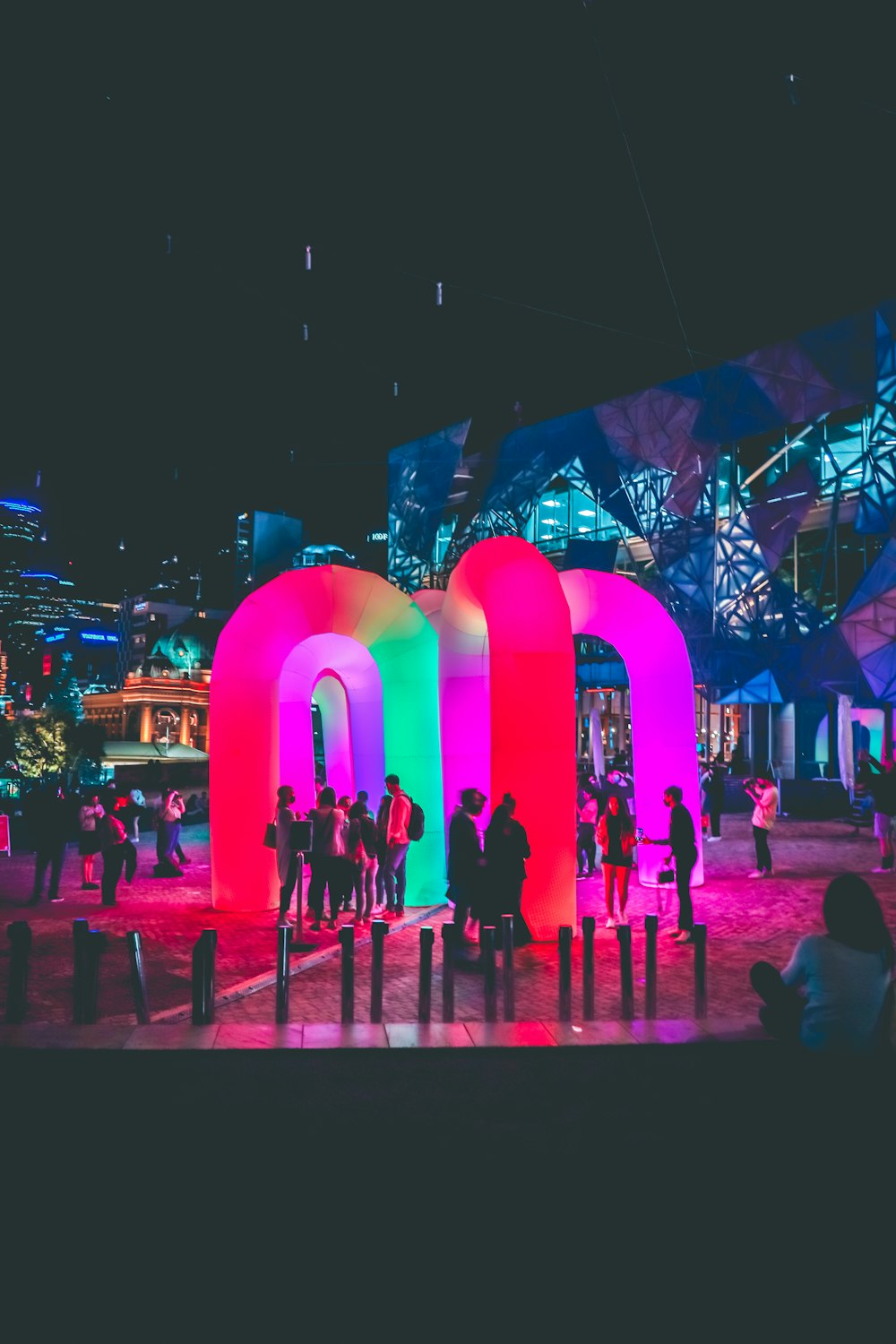 people walking on street during nighttime