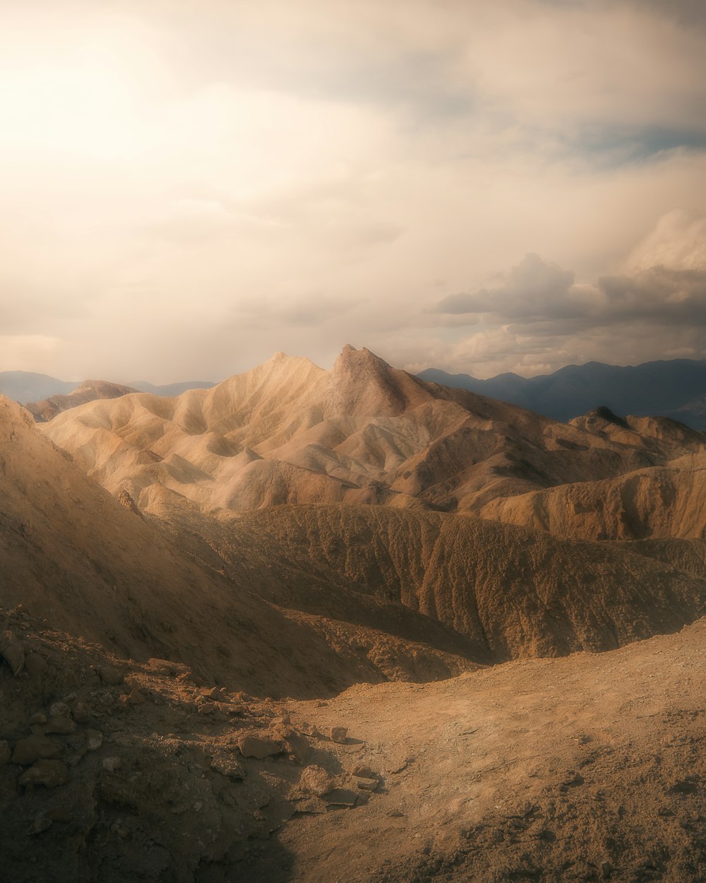 brown and gray mountains under white clouds during daytime