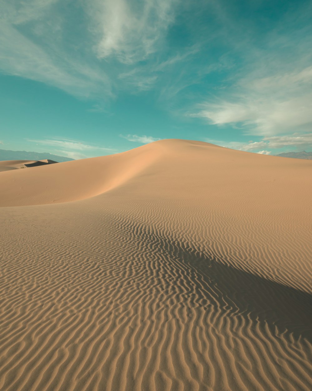 brown sand under blue sky during daytime