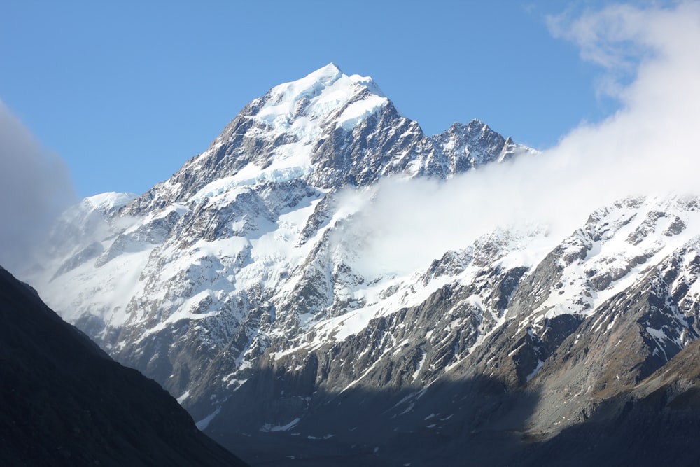 snow covered mountain under blue sky during daytime