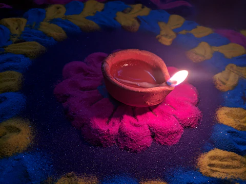 A traditional Pongal festival scene with kolam designs and festive lamps glowing warmly.