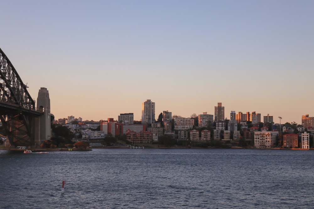 city skyline across body of water during daytime