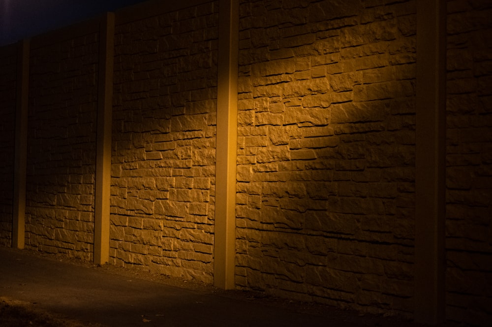 brown brick wall during night time