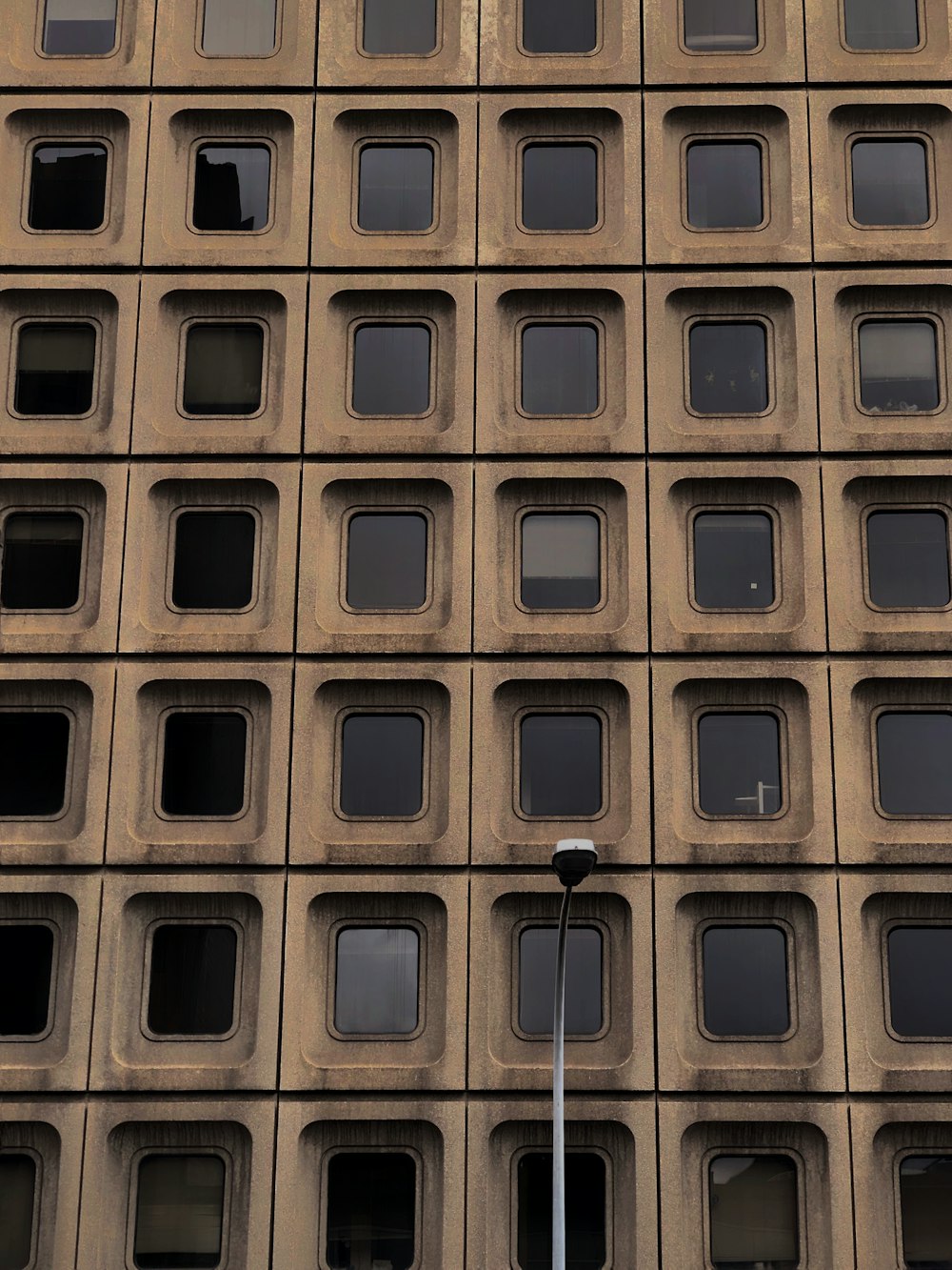 brown concrete building with windows