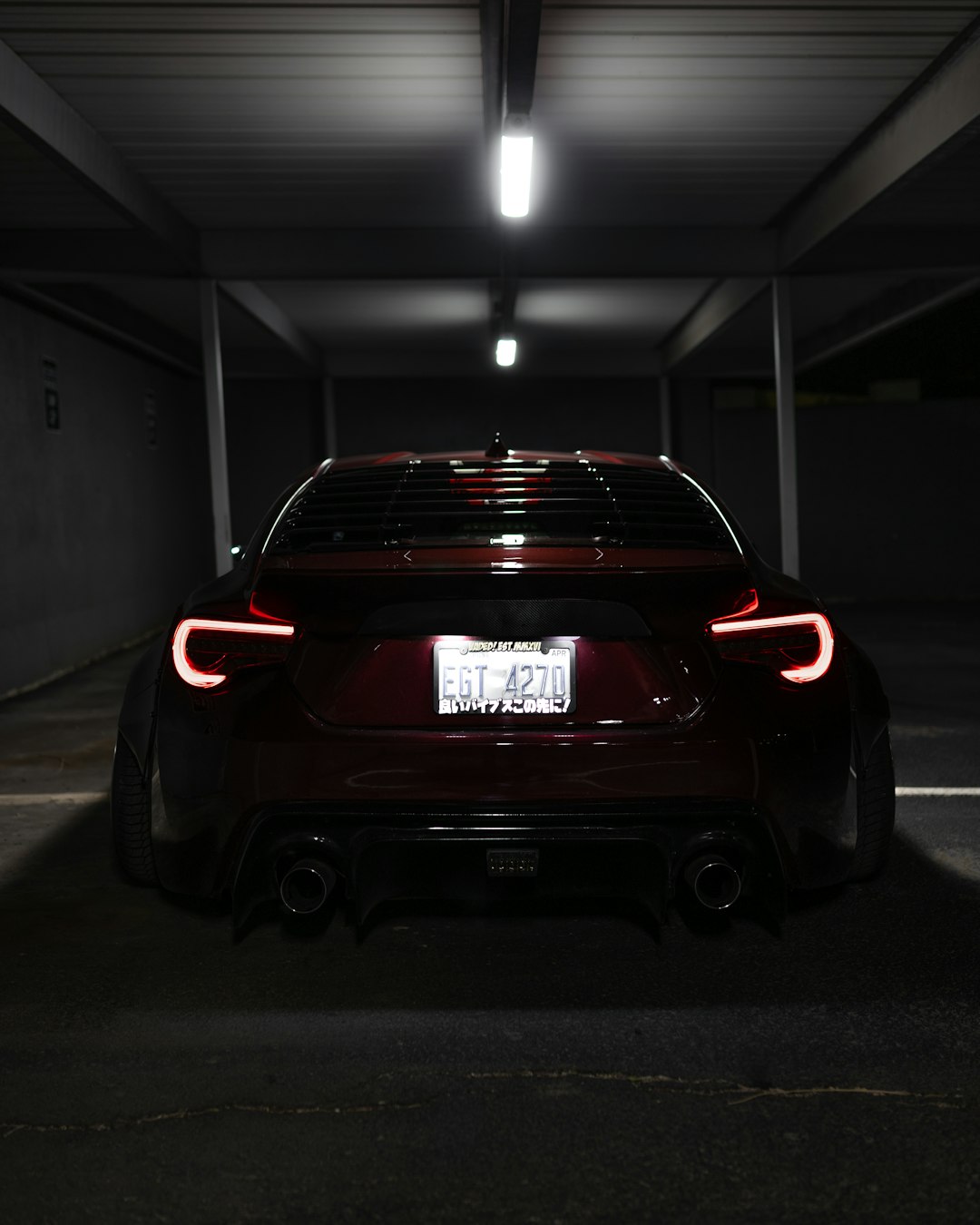 red car parked in garage