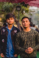 2 men in blue and brown jackets
