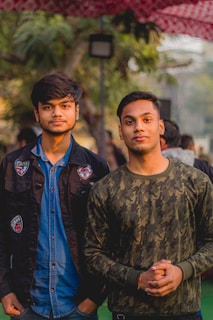 2 men in blue and brown jackets