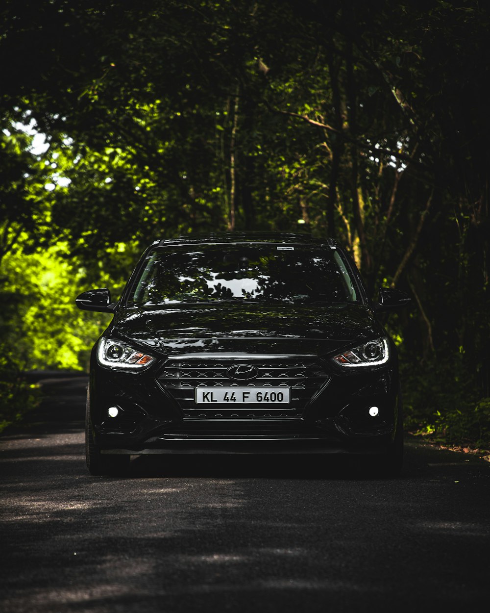 black mercedes benz car on road during daytime