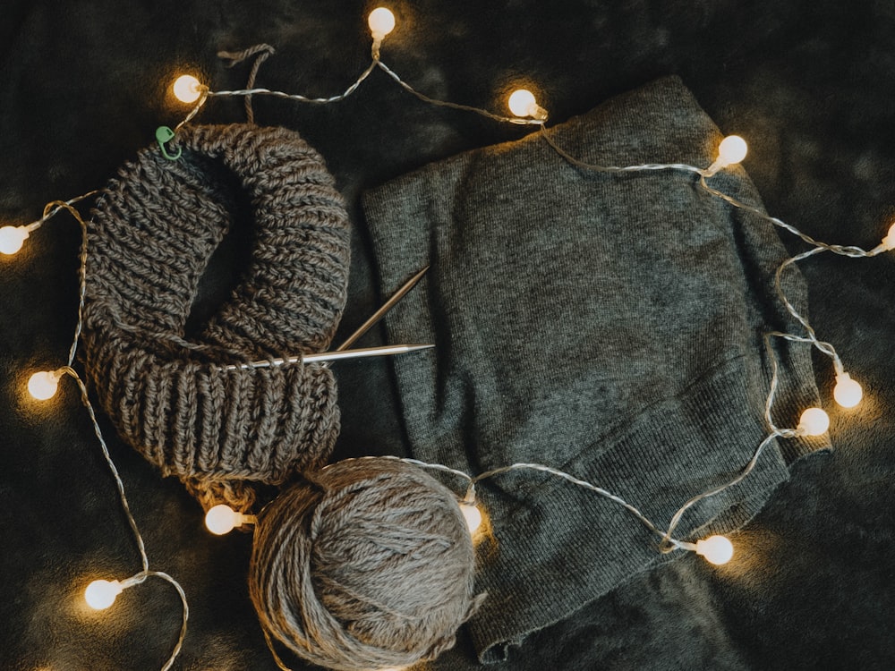 gray and brown yarn on gray textile