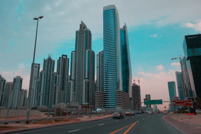 The bustling Business Bay district with modern skyscrapers and busy streets during the day.
