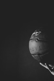 black nike basketball on persons hand