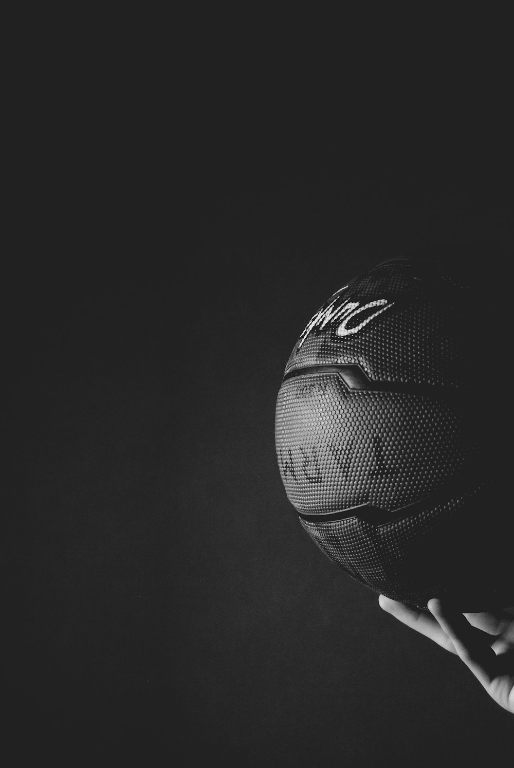 black nike basketball on persons hand