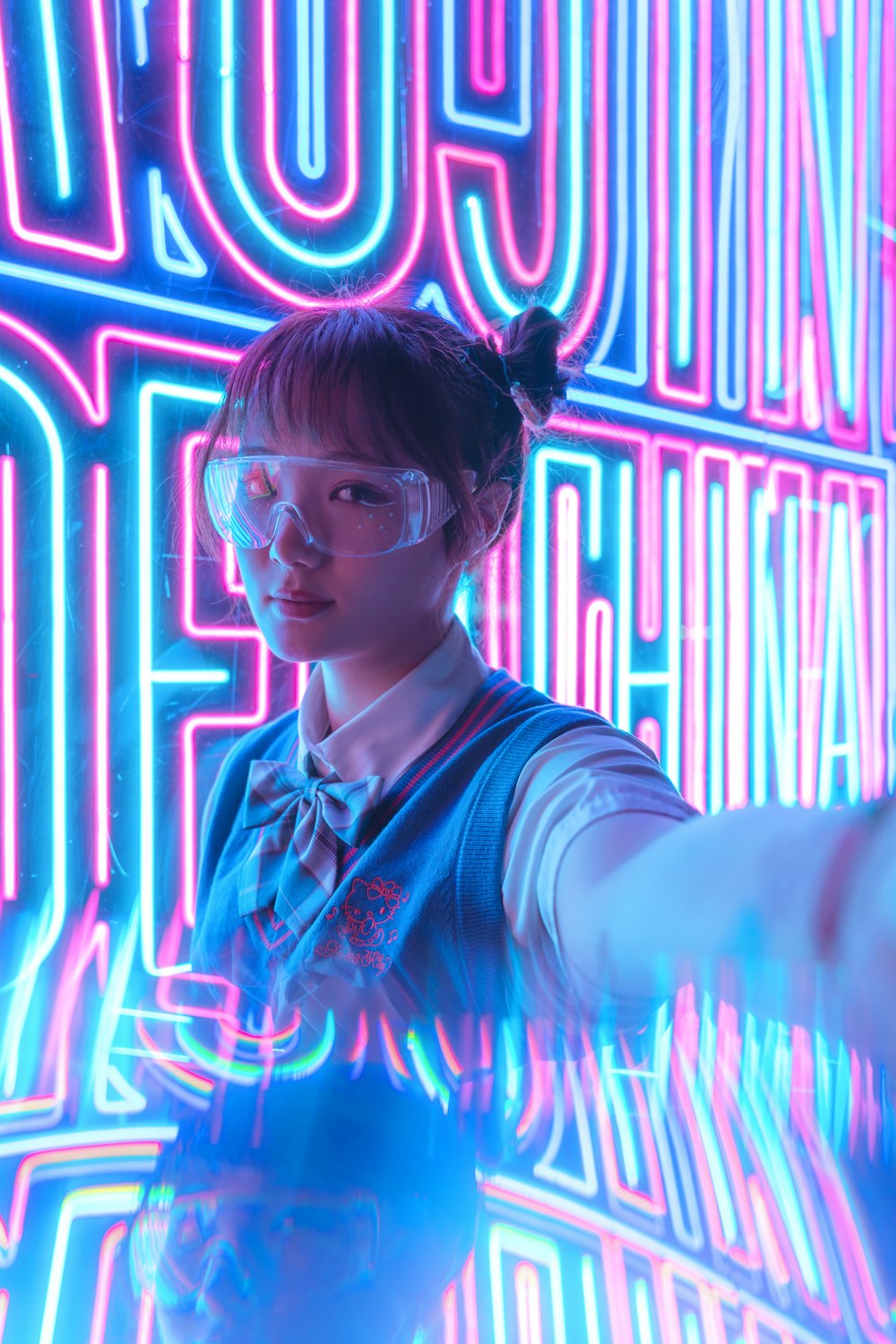 woman in blue and white shirt wearing eyeglasses