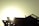 A silhouetted figure of a person is seen working on the roof of a structure against the backdrop of a bright sun. The structural components are clearly visible, with beams and supports highlighted by the strong light source.