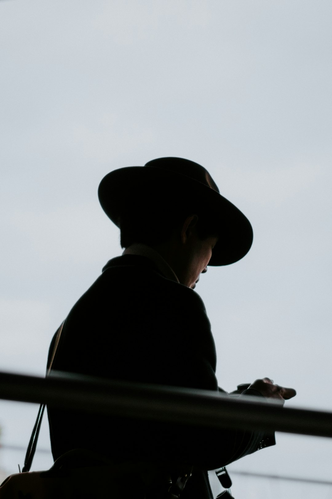 man in black hat and black shirt