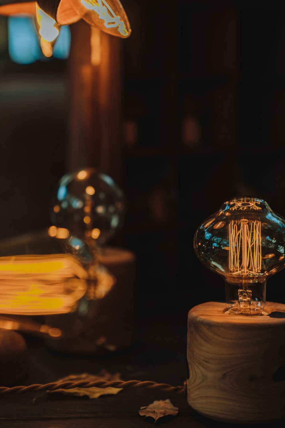 clear glass ball on brown wooden table