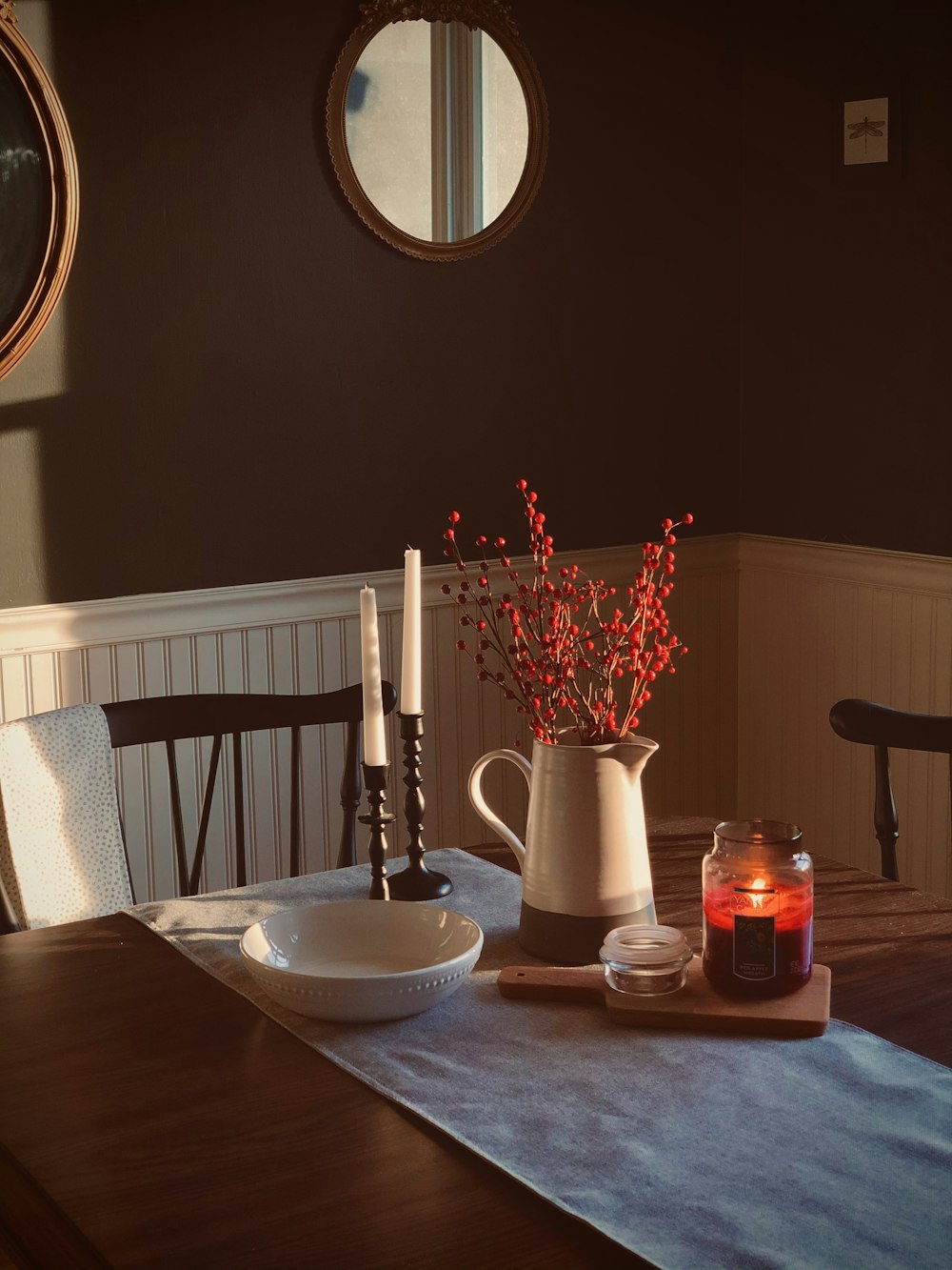 white ceramic pitcher on brown wooden table