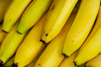 yellow banana fruit on black table